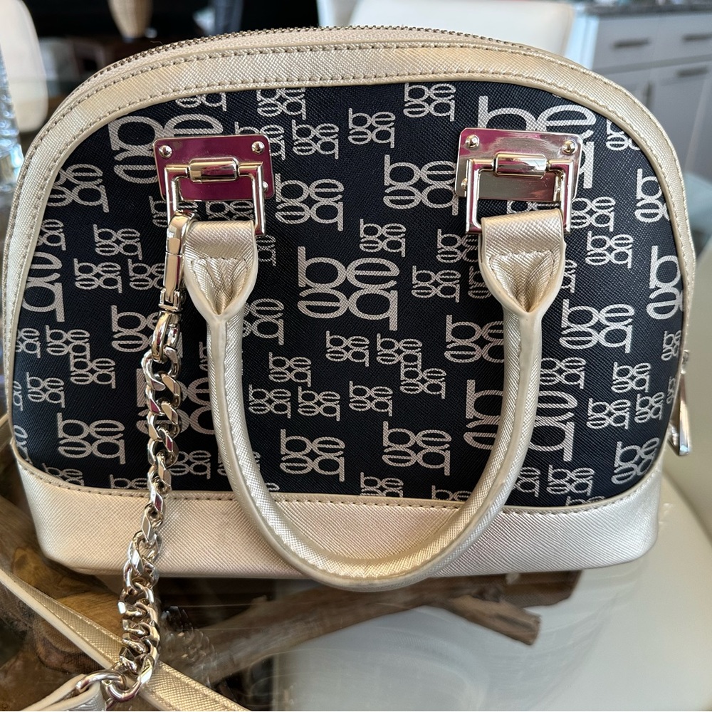 Bebe gold and black purse.